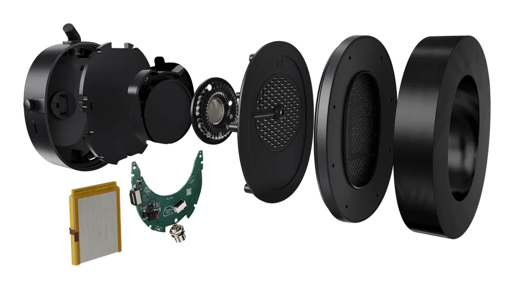 QHR ear cup taken apart: shell, damping, driver, board and battery